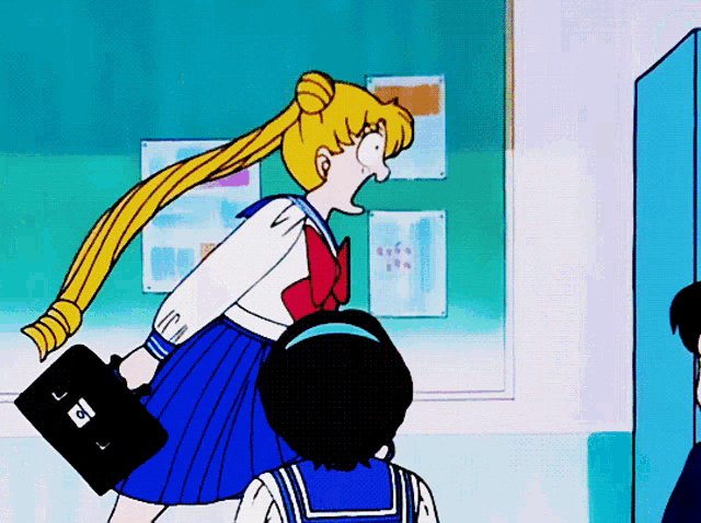 a girl in a sailor suit is holding a black briefcase with the letter c on the front