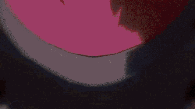 a close up of a person wearing a black hat