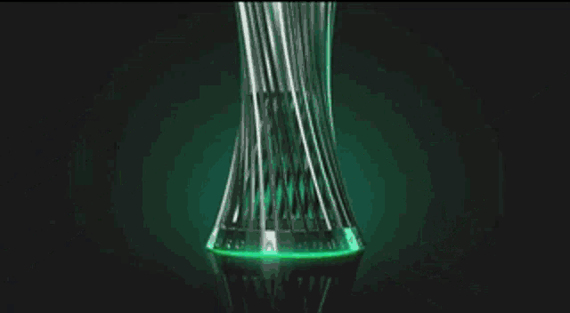 a trophy is surrounded by green and black stripes on a black background