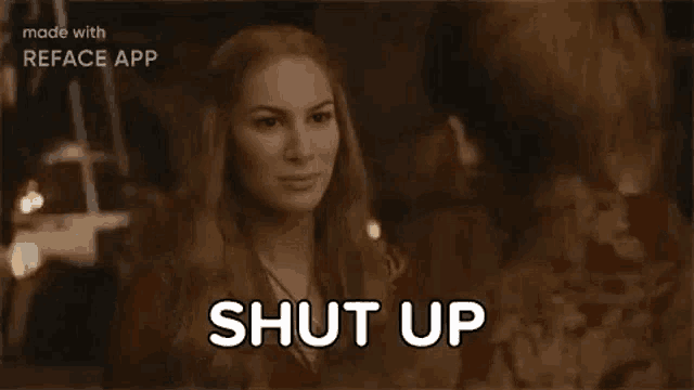 a woman is talking to a man in a room and says `` shut up '' .
