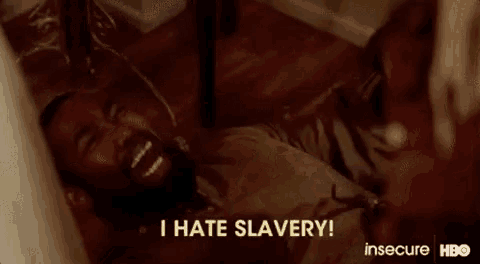 a man is laying on the floor and saying `` i hate slavery ! ''