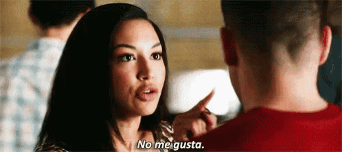 a woman is pointing at a man in a red shirt and says `` no me gusta '' .