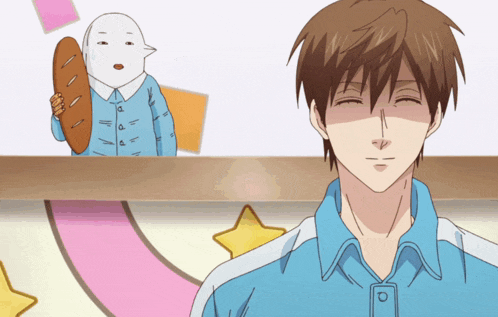 a man in a blue shirt is smiling in front of a cartoon character