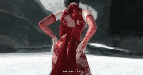 a woman in a red dress and red gloves is standing in the snow .