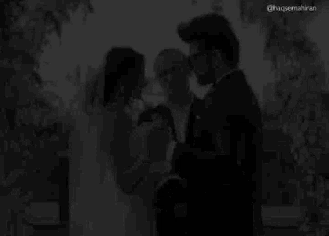 a bride and groom are holding hands at their wedding ceremony .