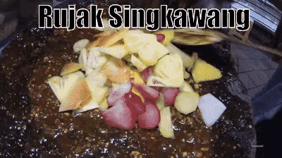 a close up of a plate of food with the words rujak singkawang above it