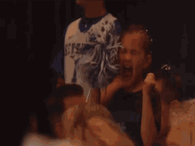 a cheerleader with kentucky on her shirt is screaming