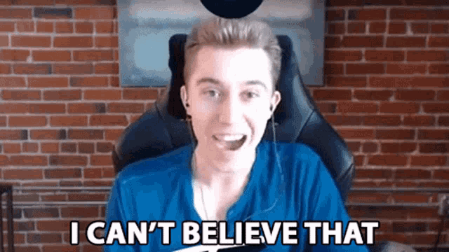 a man in a blue shirt says " i can t believe that "