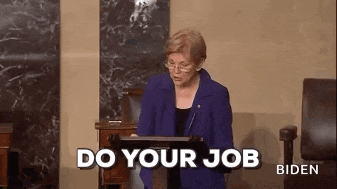 a woman is sitting at a podium giving a speech and saying do your job .
