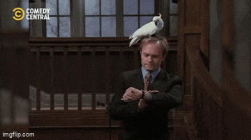a man in a suit has a bird on his head and the words comedy central are visible in the background