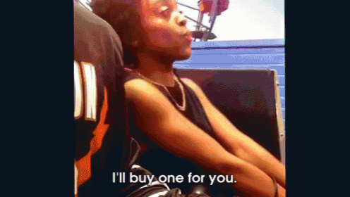 a woman is sitting on a roller coaster and talking to someone .