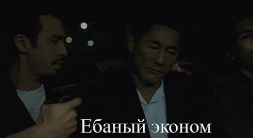 a man is sitting in the back seat of a car with a foreign language caption