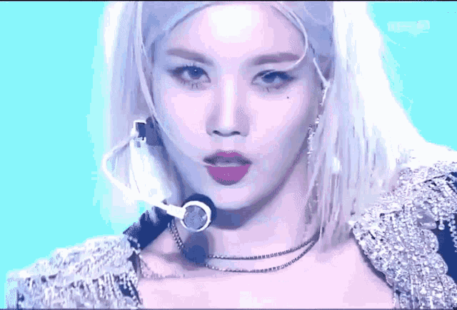 a close up of a woman 's face with a kbs logo on the bottom right