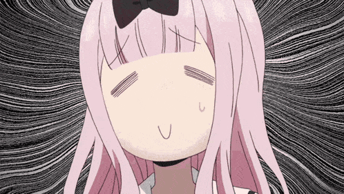 a girl with pink hair is making a funny face with her eyes closed