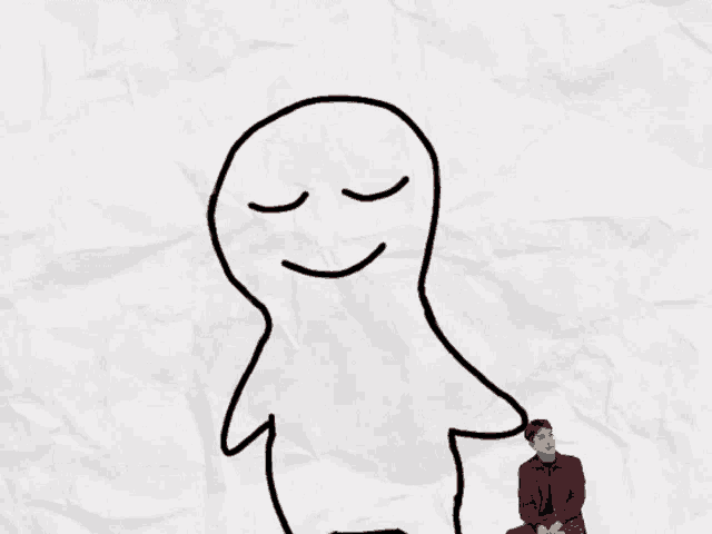 a man sits in front of a drawing of a man with a smile on his face