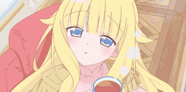 a girl with blonde hair and blue eyes holds a cup of tea
