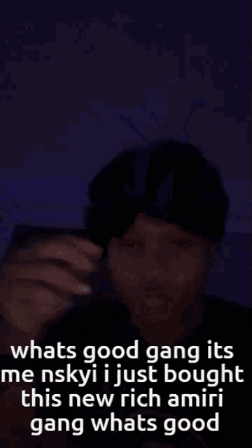a man with a ring on his finger is making a funny face with a caption that says whats good gang