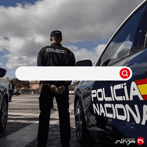 a man in a policia nacional uniform stands in front of a blue policia nacional car