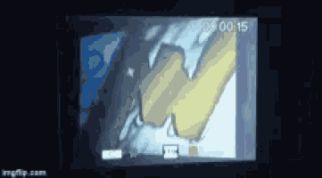a screen shows a drawing of a hand and the time of 8:15