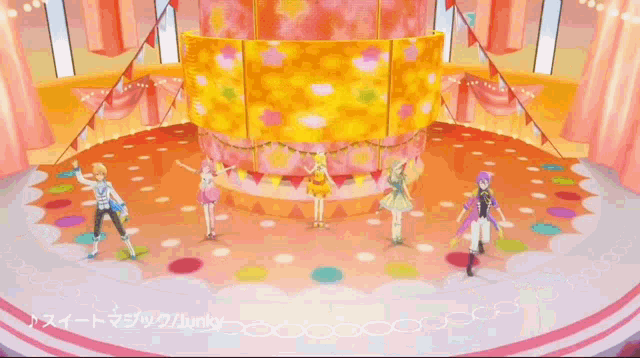 a group of people are dancing in front of a large cake that says junky on it