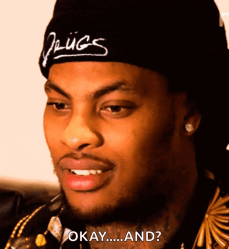 a man wearing a beanie with the word drugs on it