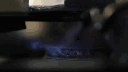 a close up of a coffee pot filled with coffee being poured into a cup .