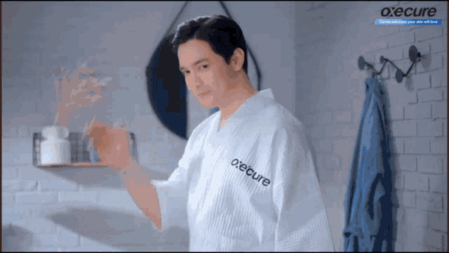 a man in a white robe with the word o'ecure on the front
