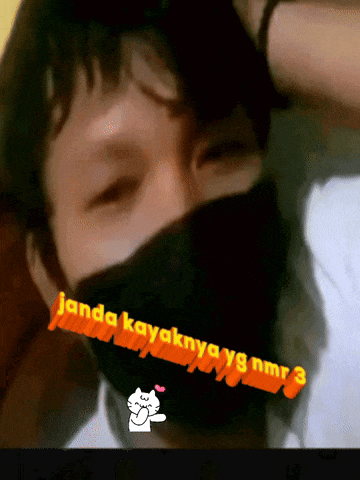 a man wearing a black mask with the words " janda kayaknyay8 nmr3 " written on it