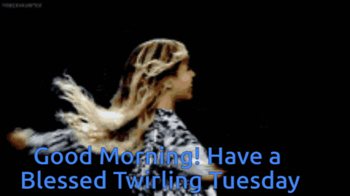 a woman with her arms outstretched and the words good morning have a blessed twirling tuesday