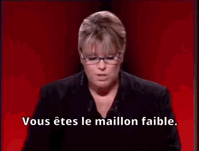 a woman wearing glasses and a black jacket says vous êtes le maillon faible