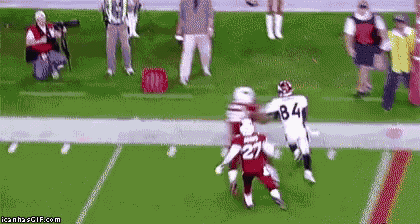 a football player with the number 84 on his jersey is running on the field