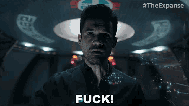 a man says " fuck " in front of a spaceship