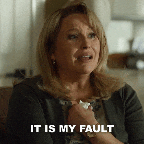 a woman is crying and the words it is my fault are on the screen