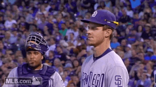 a baseball player wearing a purple san diego uniform