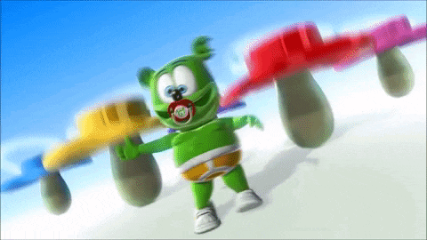 a gummy bear with a pacifier in his mouth is dancing