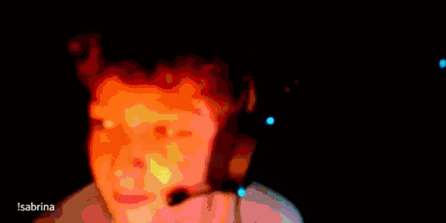 a blurred image of a person 's face with a blue background