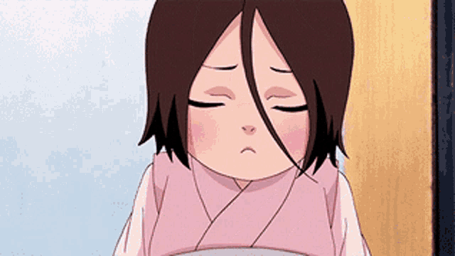 a little girl with a sad look on her face is wearing a pink kimono