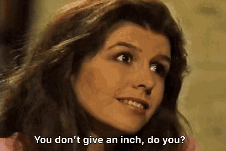 a woman is talking to another woman and saying `` you don 't give an inch , do you ? ''