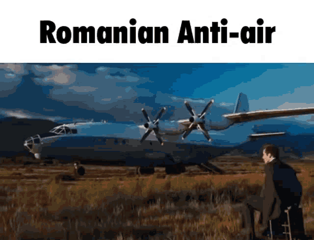 a man is sitting on a stool in front of an airplane that says romanian anti-air .
