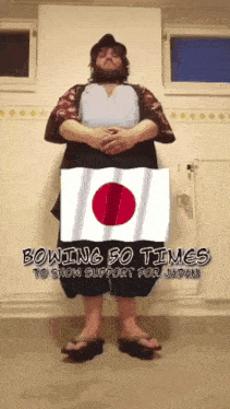 a man standing in front of a flag with the words bowing 50 times to show support for japan on the bottom