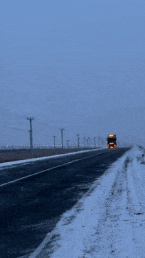 a truck is driving down a snowy road and the word mayor is on the bottom right