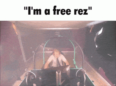 a man sitting in front of a computer with the words " i 'm a free rez "