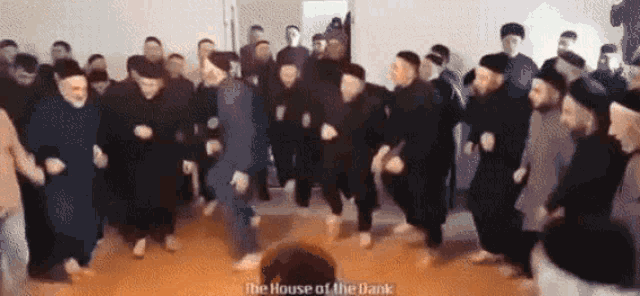 a group of men are dancing in a room with the words " the house of the dank " written on the bottom