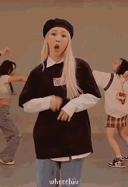 a girl wearing a black shirt that says my name is on it is dancing
