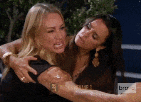 two women are hugging each other with the words bravo on the bottom
