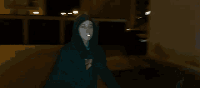 a man in a black hoodie with the word supreme on it