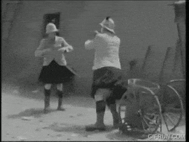 a black and white photo of two men standing next to each other with gifrun.com written on the bottom