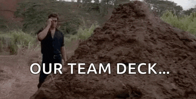 a man is standing in front of a pile of dirt with the words `` our team deck ... that is one big pile of shit . ''