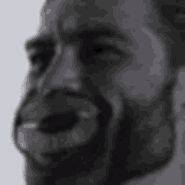 a black and white photo of a person 's face with a pixelated pattern on it .