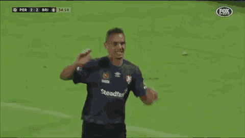 a soccer player is doing a handstand on the field during a fox sports game